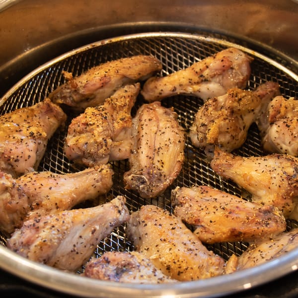How to cook wings in Air Fryer that are crispy and taste like they are deep fried. Simple instructions for basic salt and pepper chicken wings. Add sauce after for sweet and sticky wings.