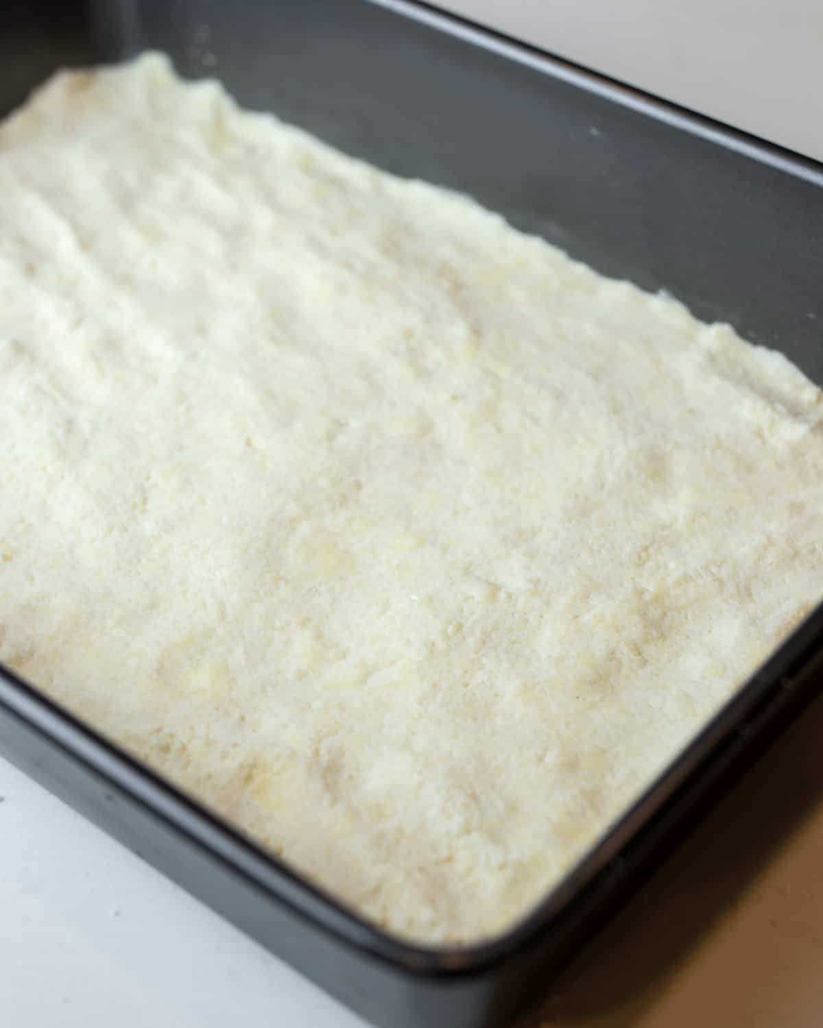 A baking pan with shortbread crust.