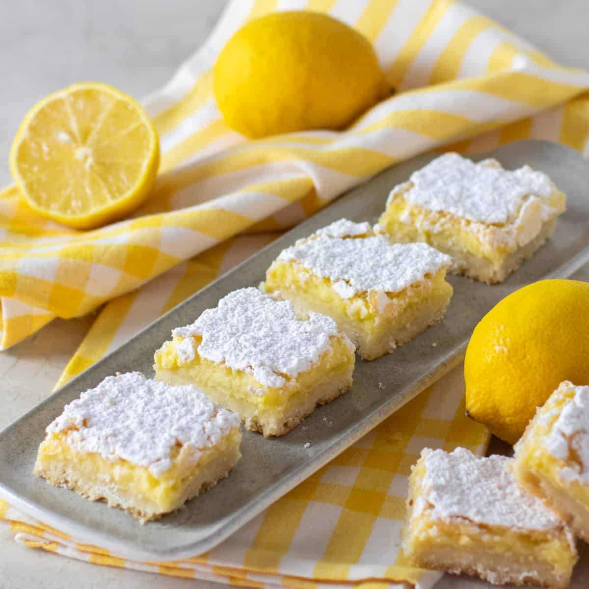 Lemon bars on a serving tray.